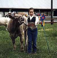 Katie, age 11, with steer Waldo, 12 1/2 months, Champion Youth Fair